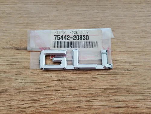 toyota-carina-e-gli-znaczek-emblemat-lewy-klapy-tyl-92-96-a75442-20830-75442-20830-edcar-ed-car.pl-7178683