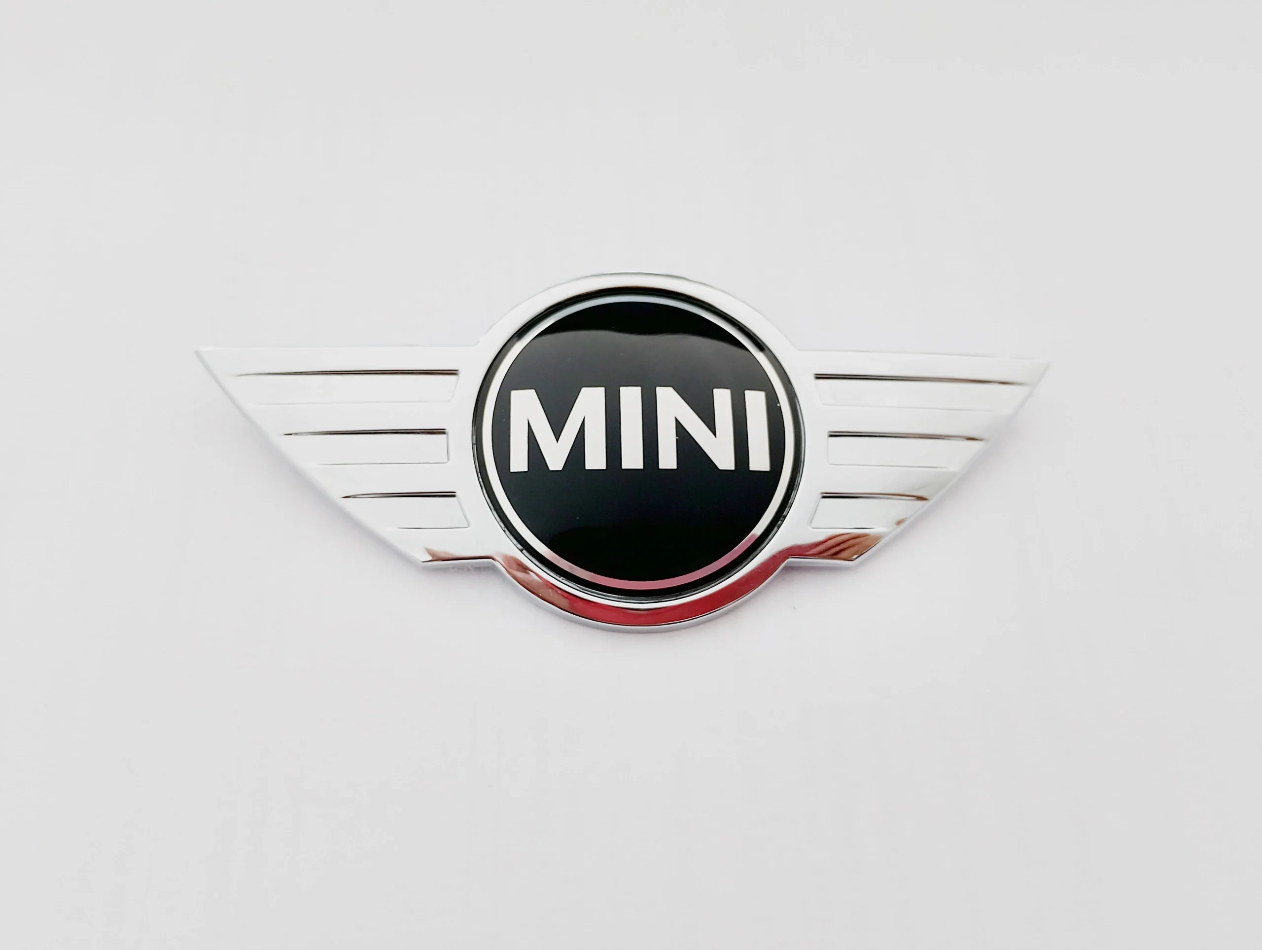 mini-cooper-r55-r56-r57-znaczek-logo-maski-06-10-51142754972-2754972-51-14-2-754-972-ed-car-ed-car.pl-7199726